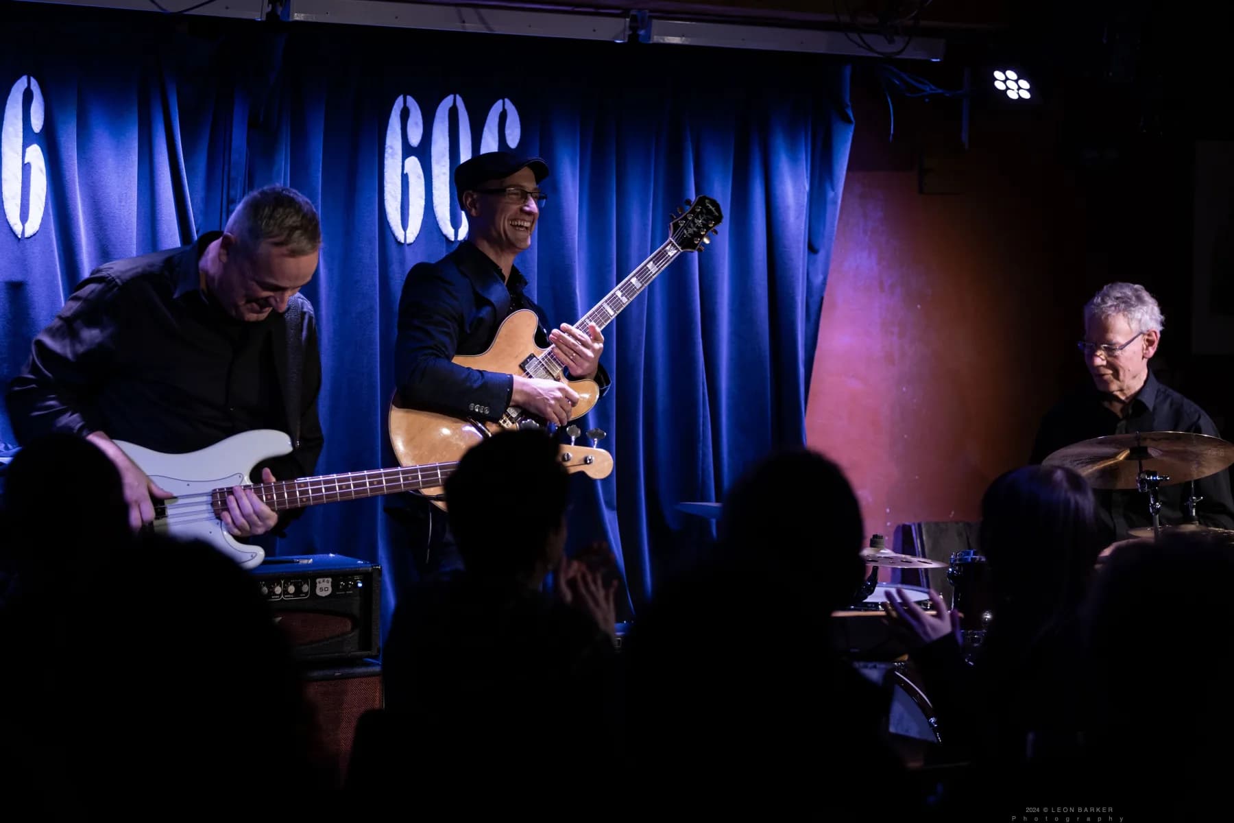 Pete Roth Trio musician framed by blue stage light during a live set.