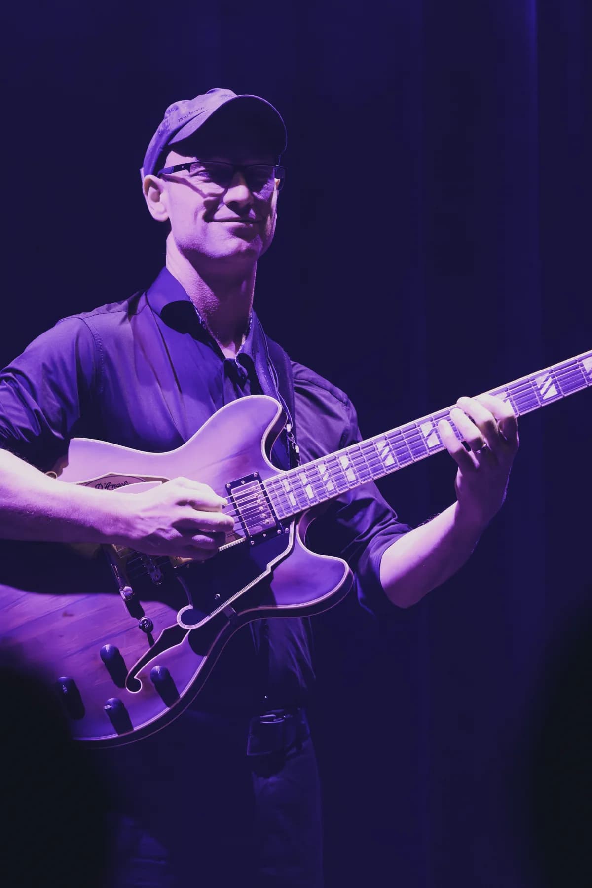 Pete Roth Trio live photo with guitar and rhythm section on stage.
