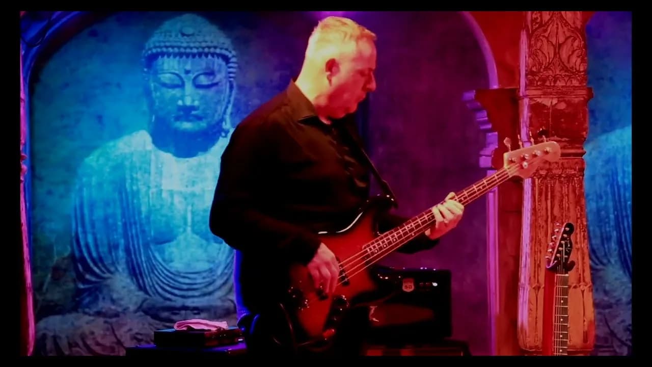 Pete Roth Trio performing Full Circle on a red-lit stage.